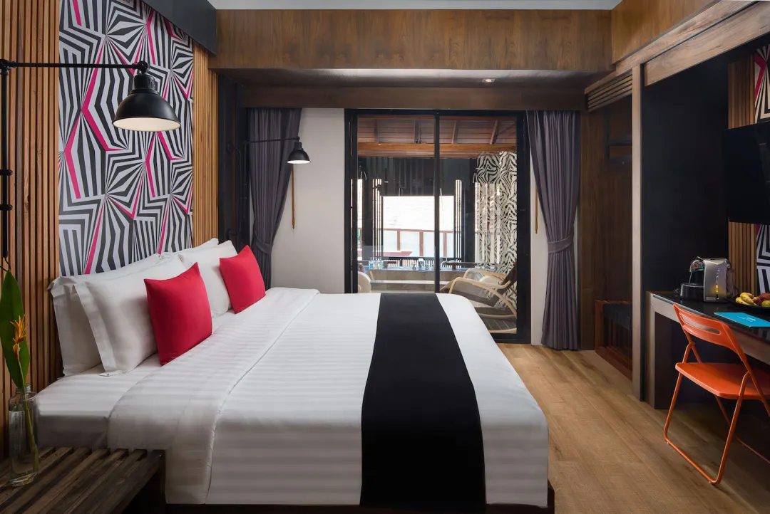 Deluxe Balcony Suite - Bedroom with Balcony View