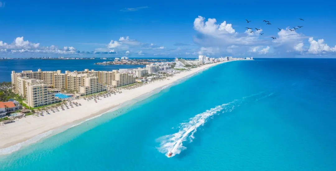 Cancun beach with boats 