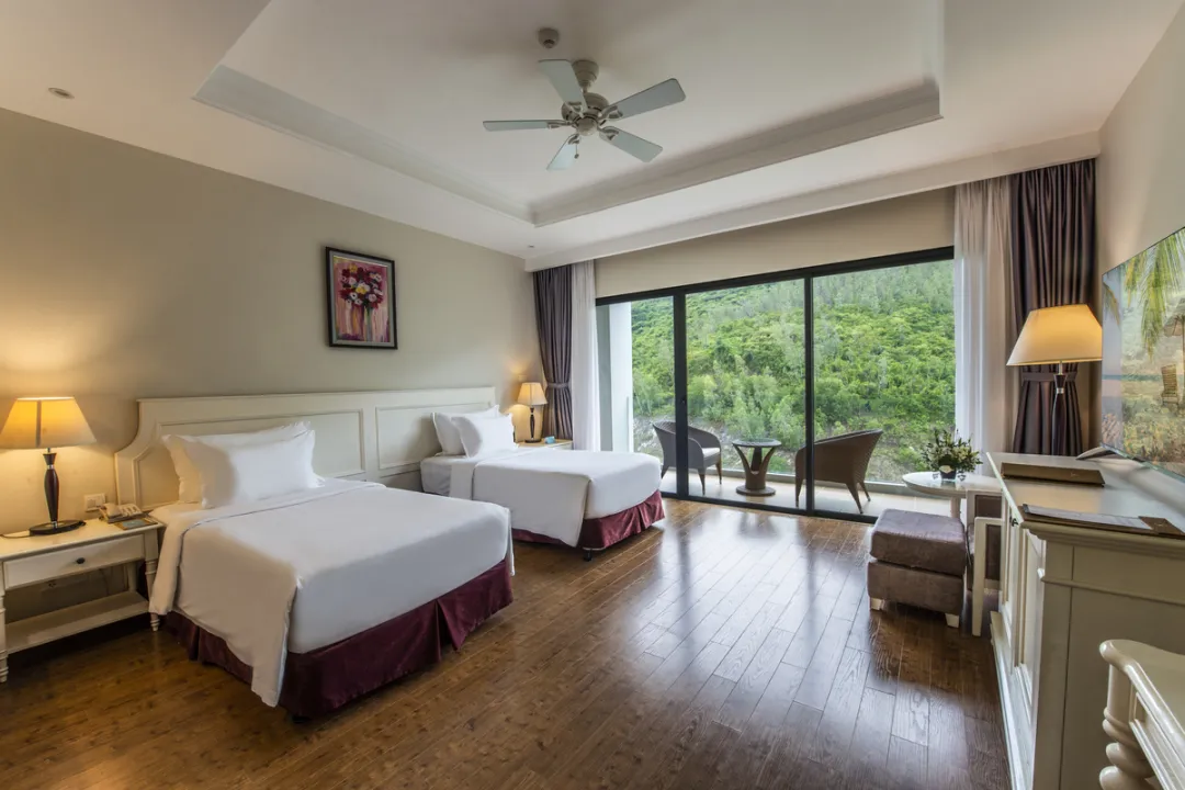 Deluxe Twin Bed - Bedroom with Balcony View