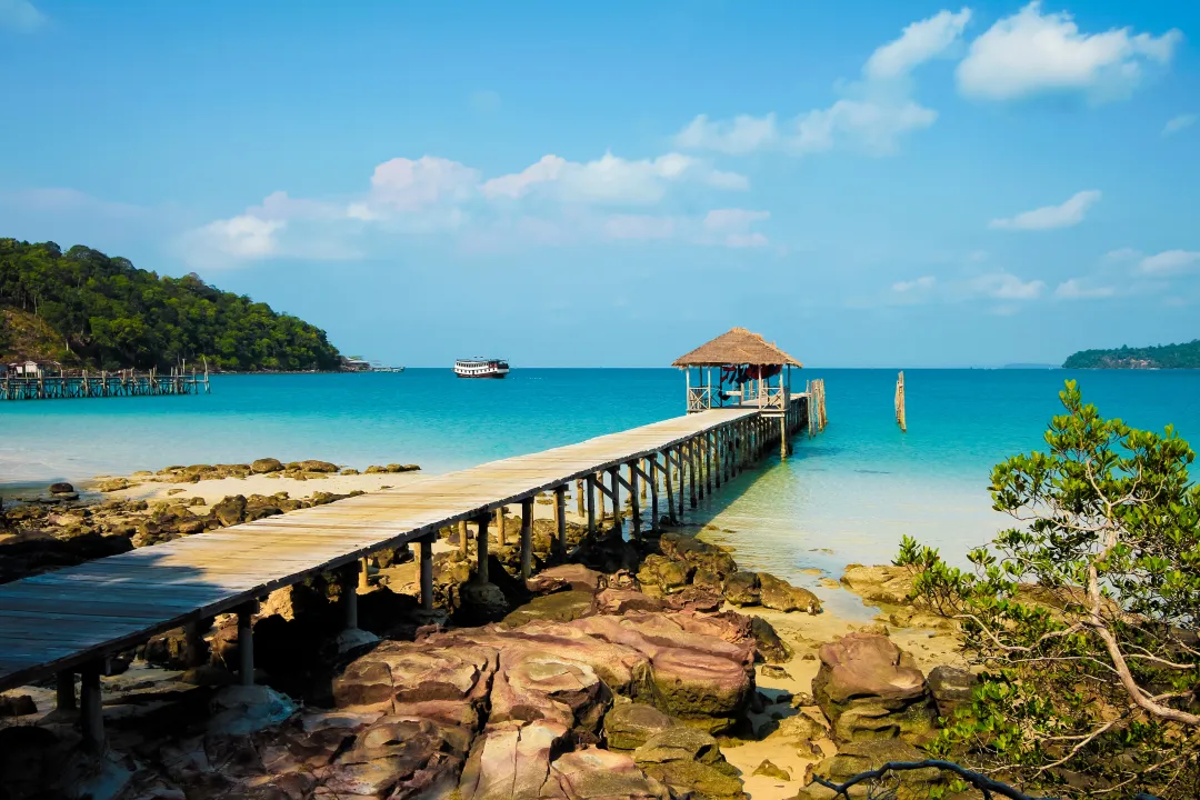 Pier at the beautiful white sand beach on this holiday island, saracen ba