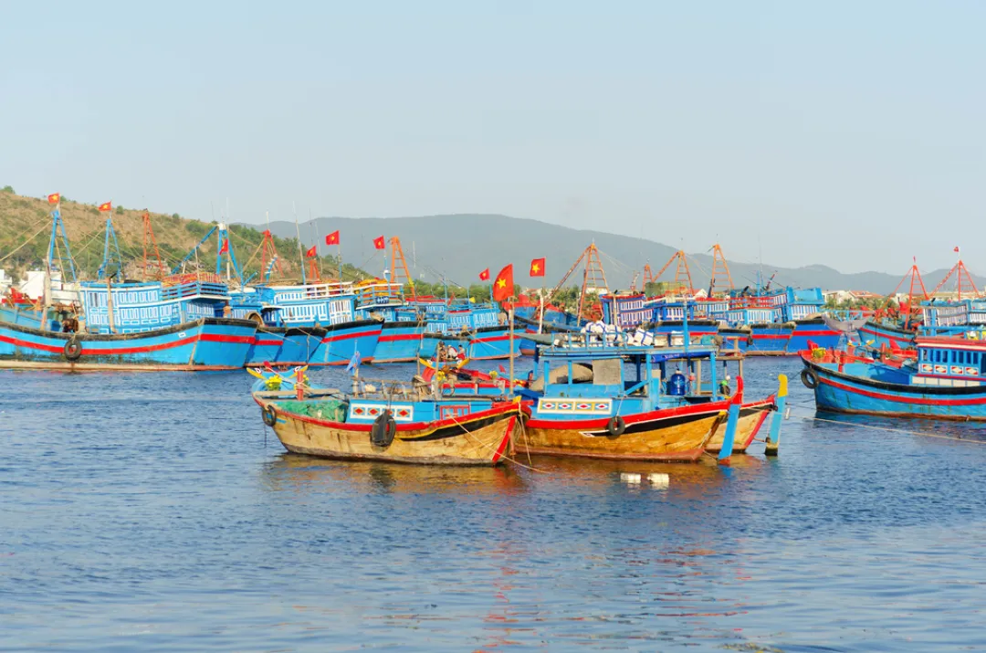 Nha Trang - Fishing boats with red flags in marina