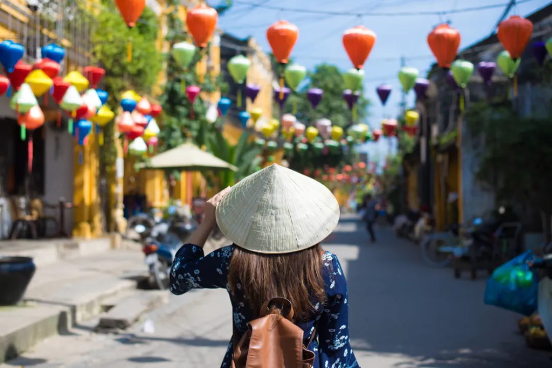 Hoi An -  Woman wandering down the street
