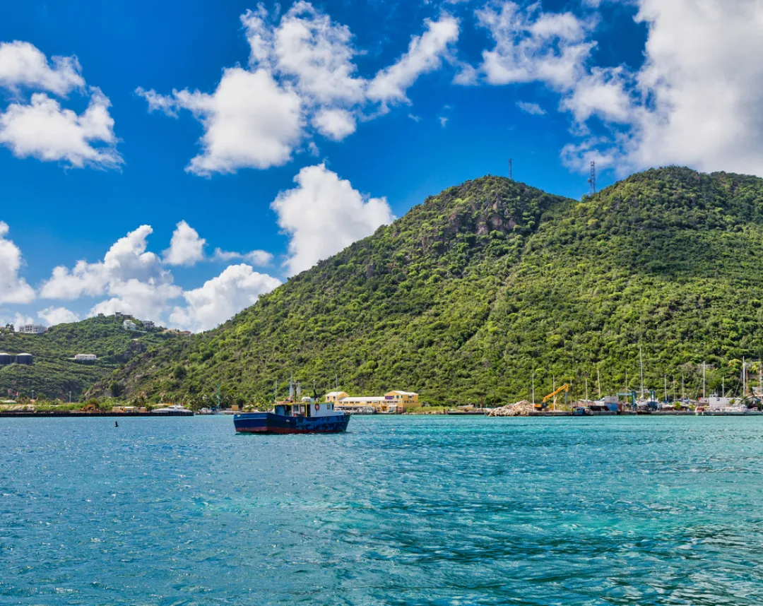 Old Blue Boat Moored by Green Hills in St Maarten