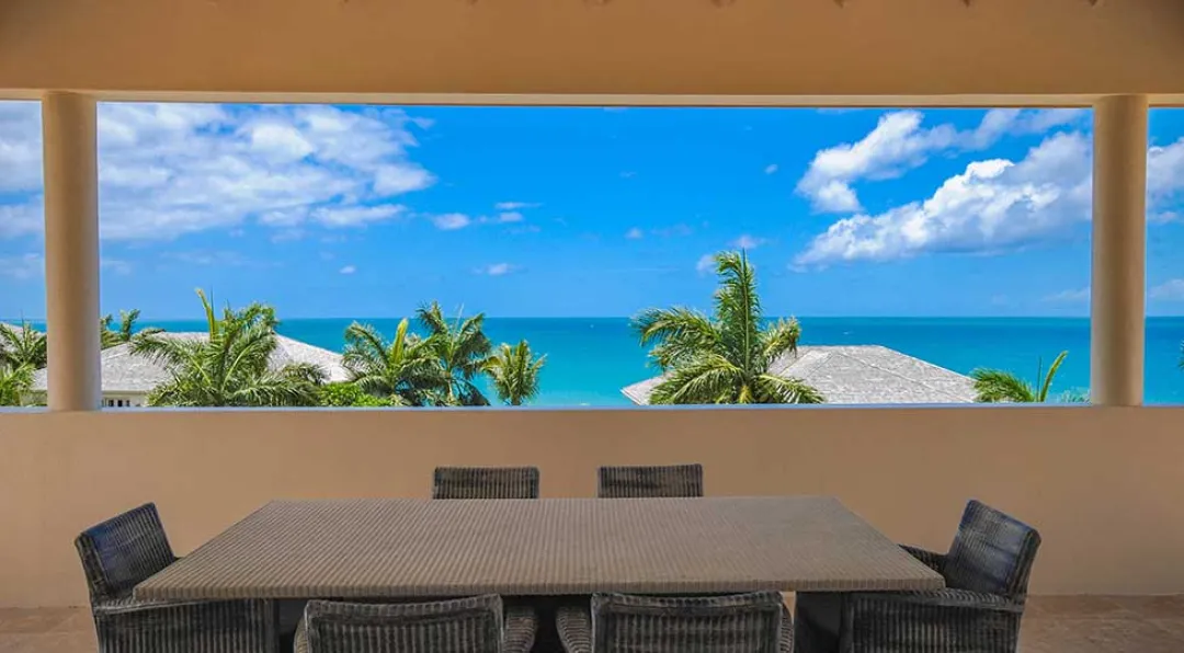 Three Bedroom Cove Penthouse - Balcony Lounge with Sea View