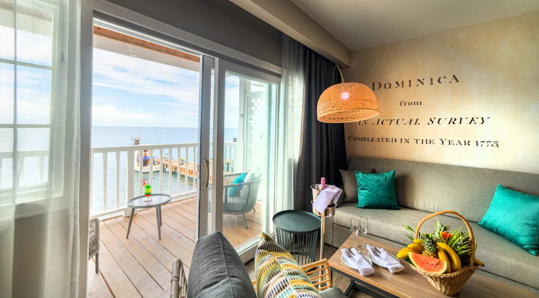 Fort Young Hotel and Dive Resort - Deluxe Oceanfront Room - Living Area