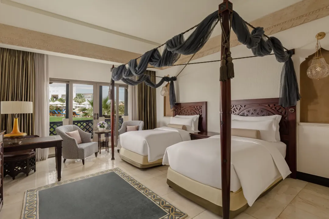 Sharq-Village-and-Spa-Deluxe-Room-Pool-View-Twin-Beds