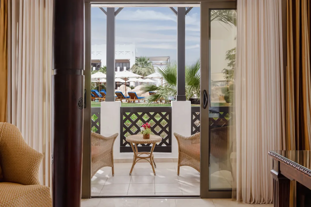 Sharq-Village-and-Spa-Deluxe-Room-Pool-View-Terrace
