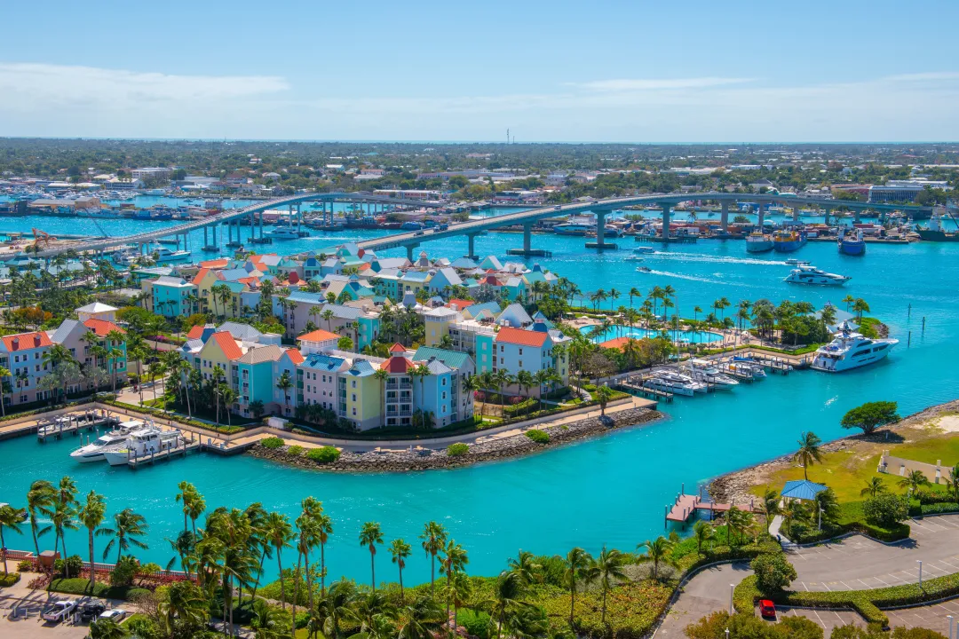 Harborside Villas aerial view at Nassau Harbour with Nassau downtown at the background, from Paradise Island, Bahamas.