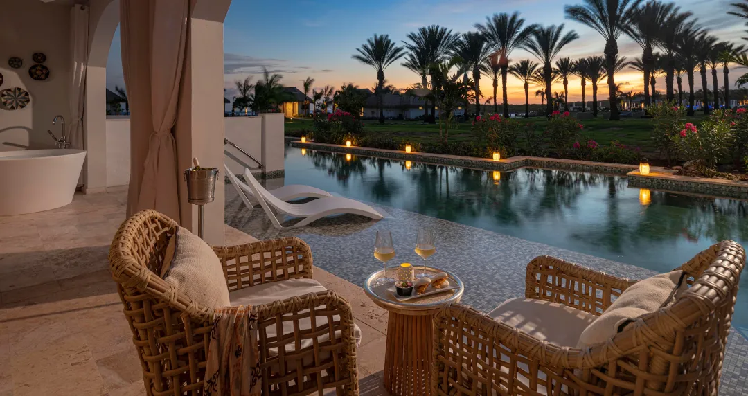 Carisia One Bedroom Swim-up Butler Suite with Patio Tranquility Soaking Tub - Pool with View at Night