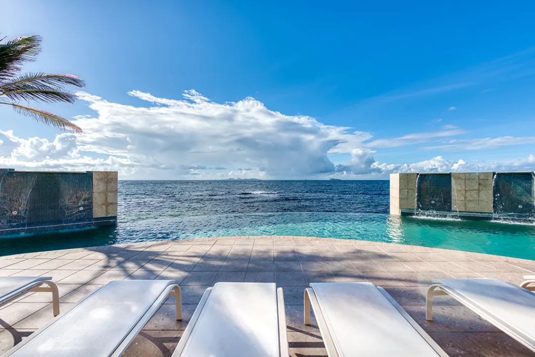 Odysseys Travel - Oyster Bay Beach Resort - Pool Lounge Sea View