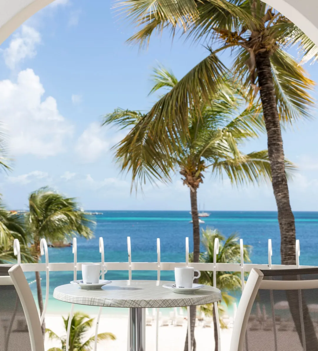 Odysseys Travel - Holland Beach House Hotel - Beach View - Balcony With Lounge With Sea View