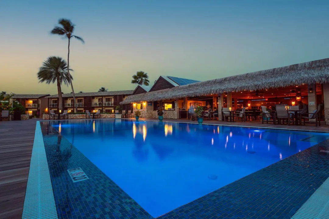 Odysseys-Travel-Manchebo-Beach-Resort-and-Spa-Pool-at-Night