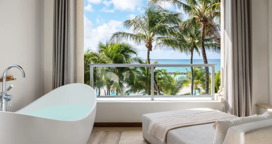 Beachfront One Bedroom Skypool Butler Suite with Balcony Tranquility Soaking Tub - Bathtub