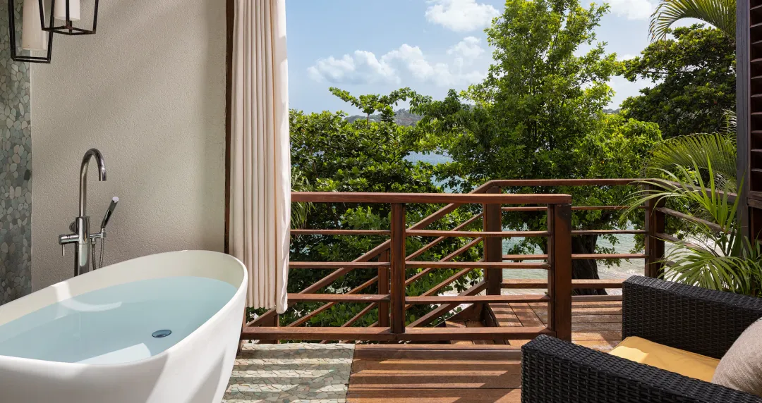 Oceanfront Two-Story One Bedroom Butler Villa Suite with Balcony Tranquility Soaking Tub - Bathtub