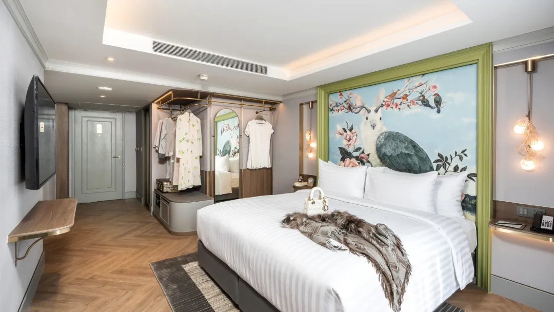 Odysseys Travel - The Salil Hotel Riverside Bangkok - Deluxe Atelier - Bedroom and TV Wall
