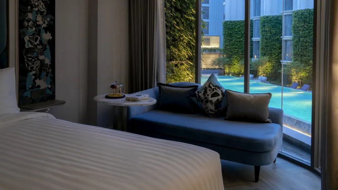Odysseys Travel - The Salil Hotel Riverside Bangkok - Deluxe Pool View - Window Seat