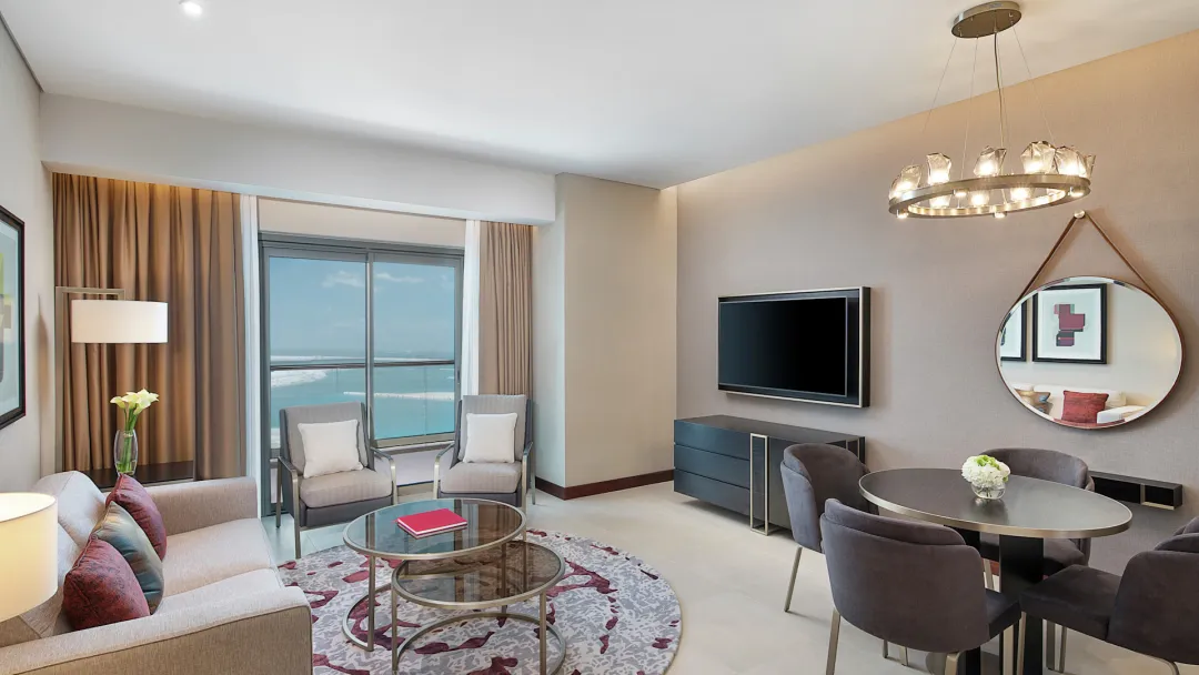 Odysseys Travel - Hilton Doha The Pearl - Rooms - Deluxe One Bedroom Suite Sea View Balcony - Living Area