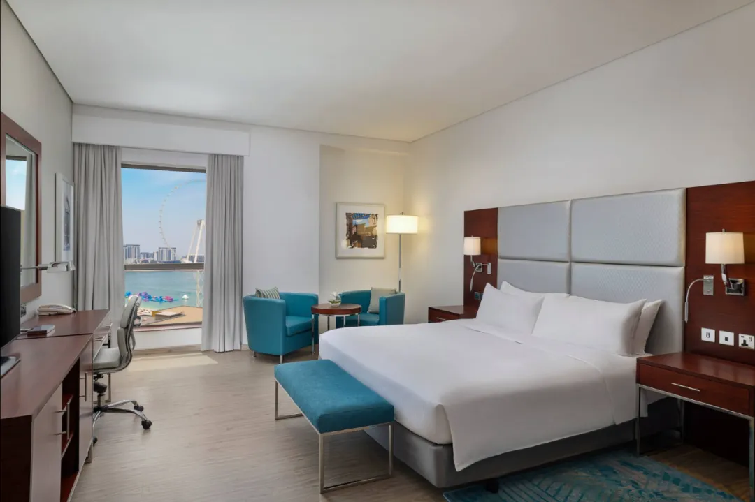 Odysseys Travel - Hilton Dubai The Walk - King Deluxe Room with Sea View - Bedroom