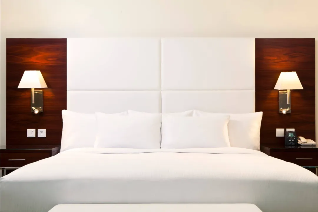 Odysseys Travel - Hilton Dubai The Walk - King Deluxe Room with Sea View - Bedroom Headboard
