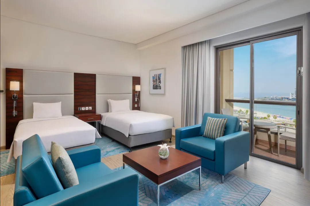 Odysseys Travel - Hilton Dubai The Walk - Twin Deluxe Room with Sea View and Balcony - Bedroom