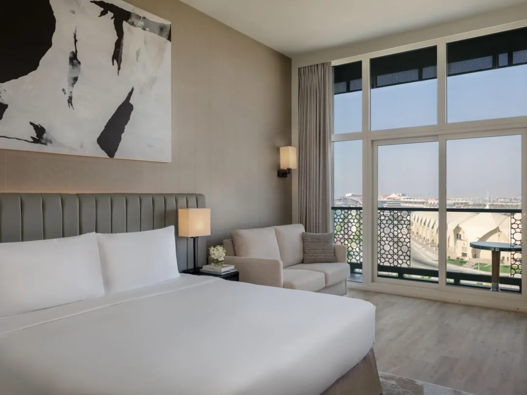 Odysseys Travel - Yas Plaza Marina by IHG - One King Deluxe Pool View Balcony Theme Park Access - Bedroom
