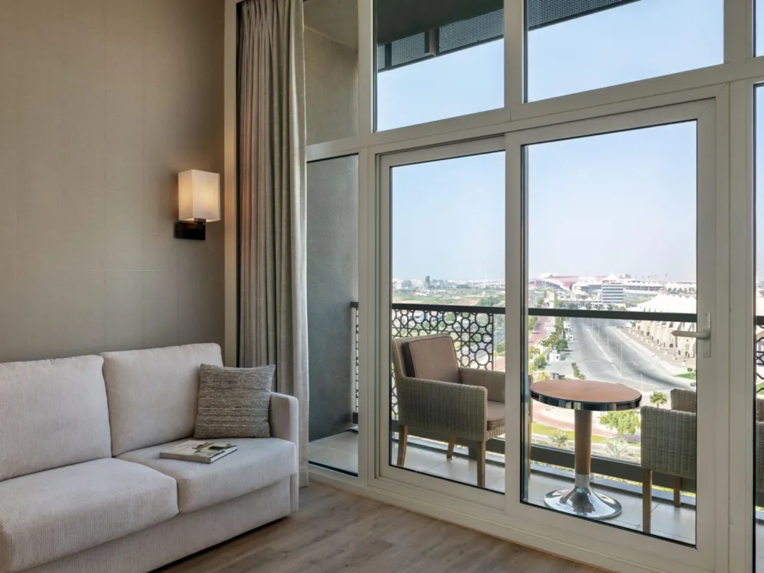 Odysseys Travel - Yas Plaza Marina by IHG - One King Deluxe Pool View Balcony Theme Park Access - Seating Area