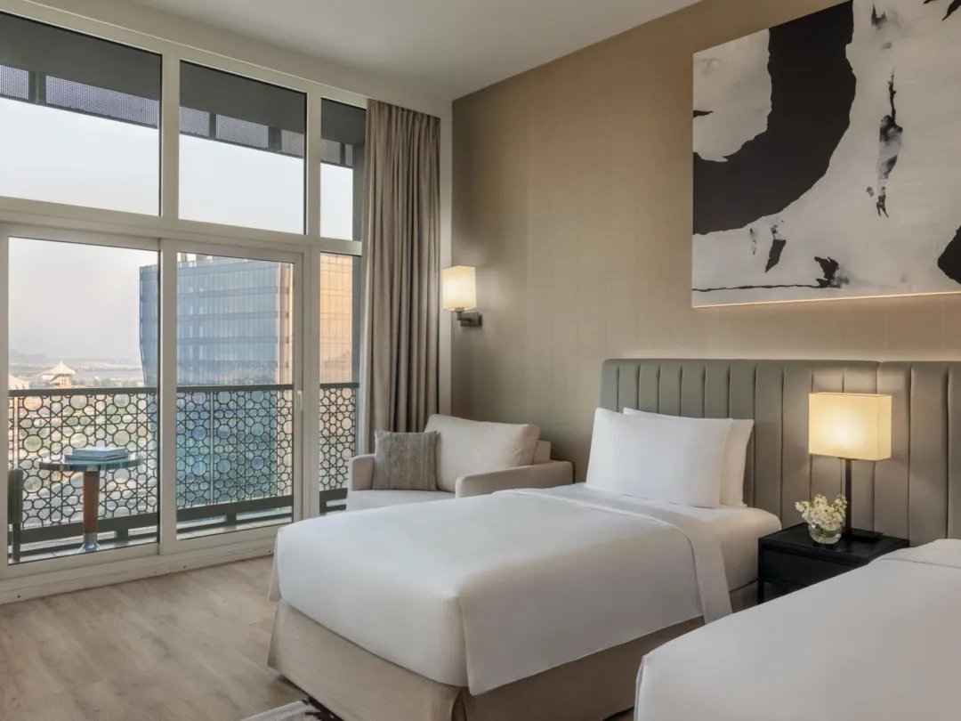 Odysseys Travel - Yas Plaza Marina by IHG - Two Twin Deluxe Pool View Balcony Theme Park Access - Bedroom
