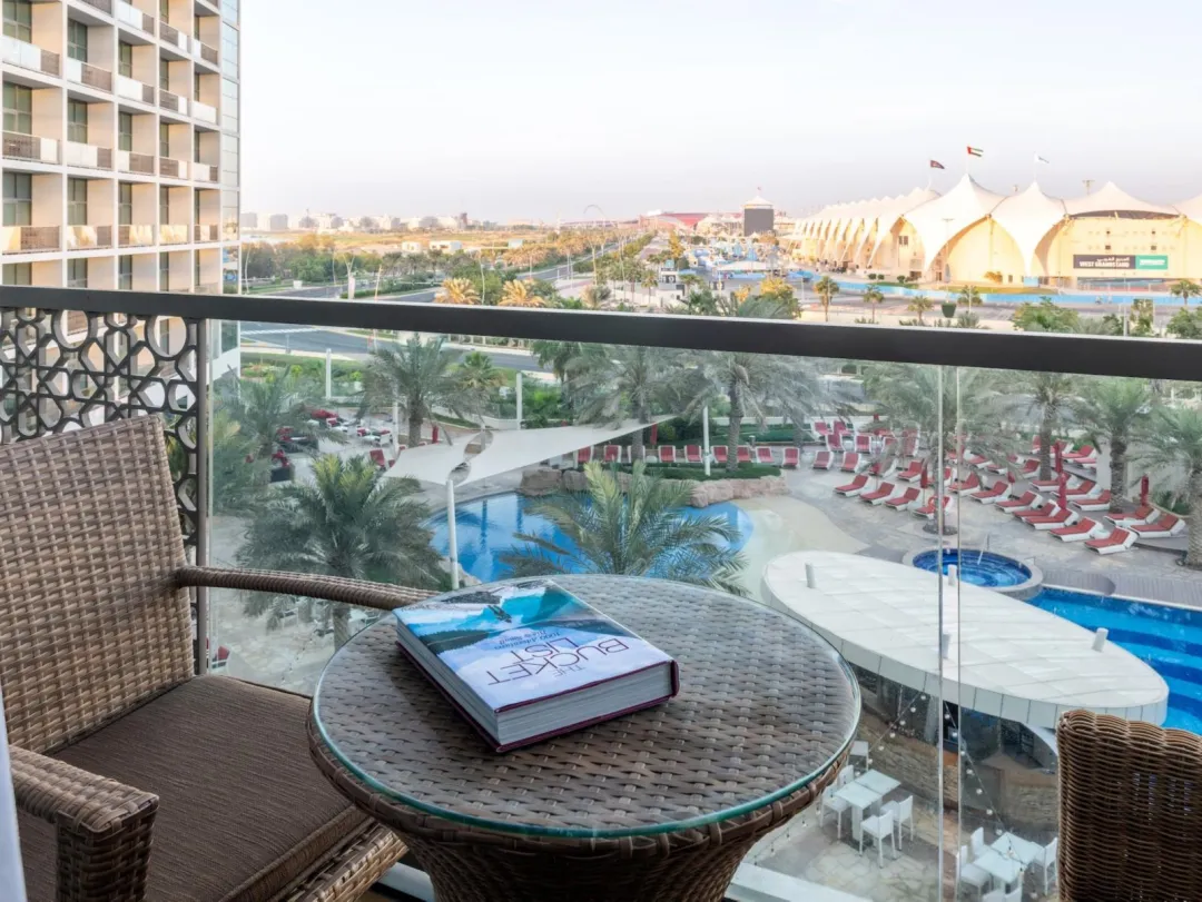 Odysseys Travel - Yas Plaza Marina by IHG - Two Twin Deluxe Pool View Balcony Theme Park Access - Balcony