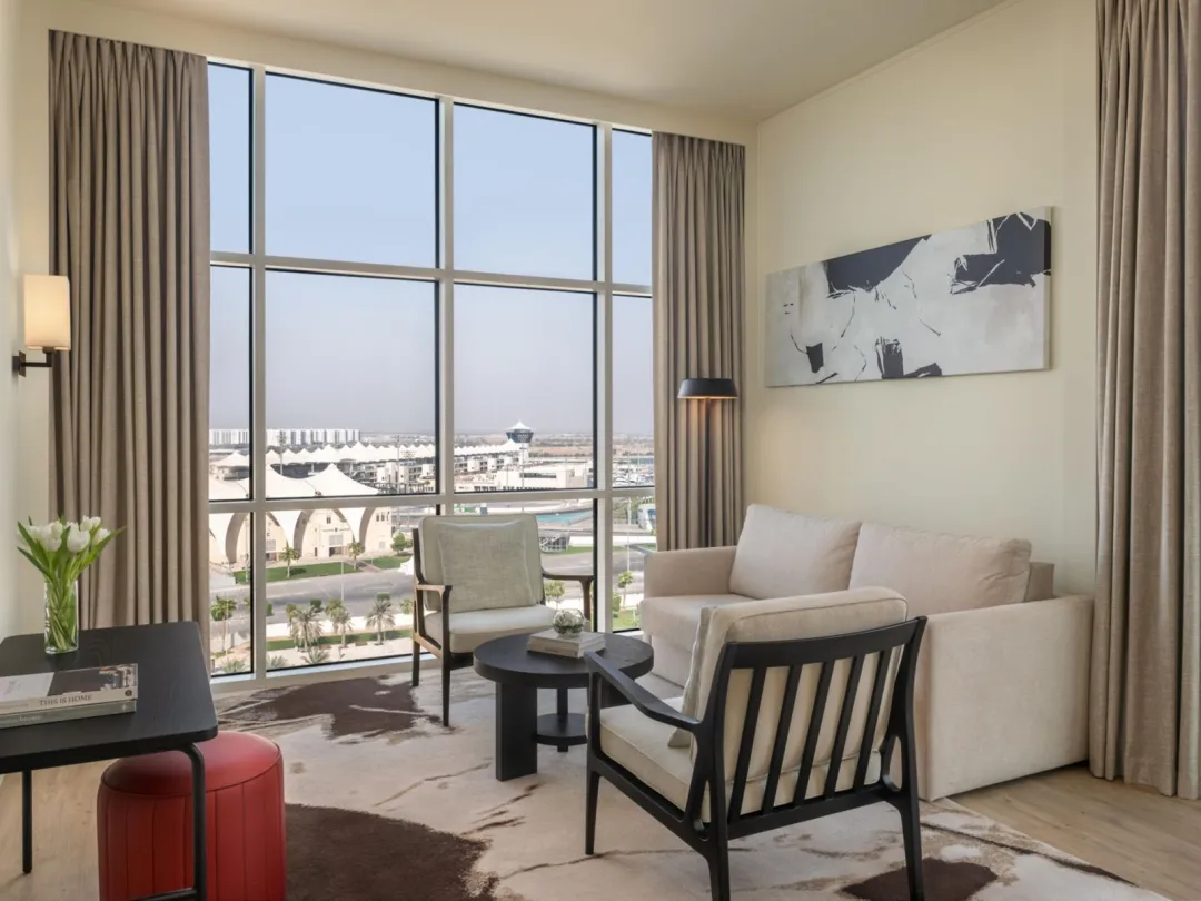 Odysseys Travel - Yas Plaza Marina by IHG - One Bedroom Suite Pool View Balcony Theme Park Access - Living Area