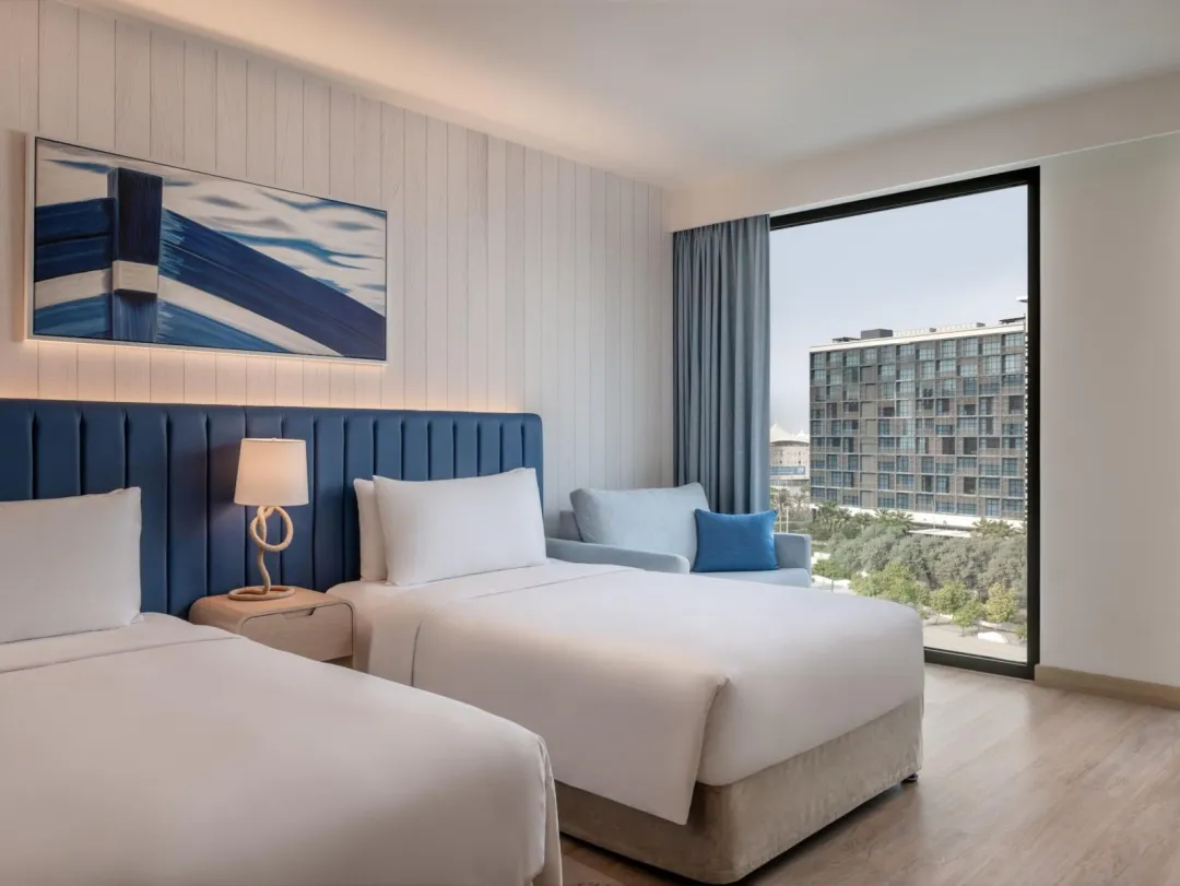 Odysseys Travel - Crowne Plaza Abu Dhabi - Yas Island by IHG - Two Twin Deluxe Plaza View Theme Park Access - Window View