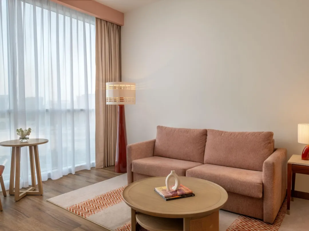 Odysseys Travel - Yas Plaza Circuit - Yas Island by IHG - One Queen Family Suite Plaza View Theme Park Access - Living Area