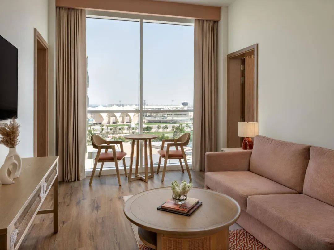 Odysseys Travel - Yas Plaza Circuit - Yas Island by IHG - Two Bedroom Suite Pool View Theme Park Access - Living Area
