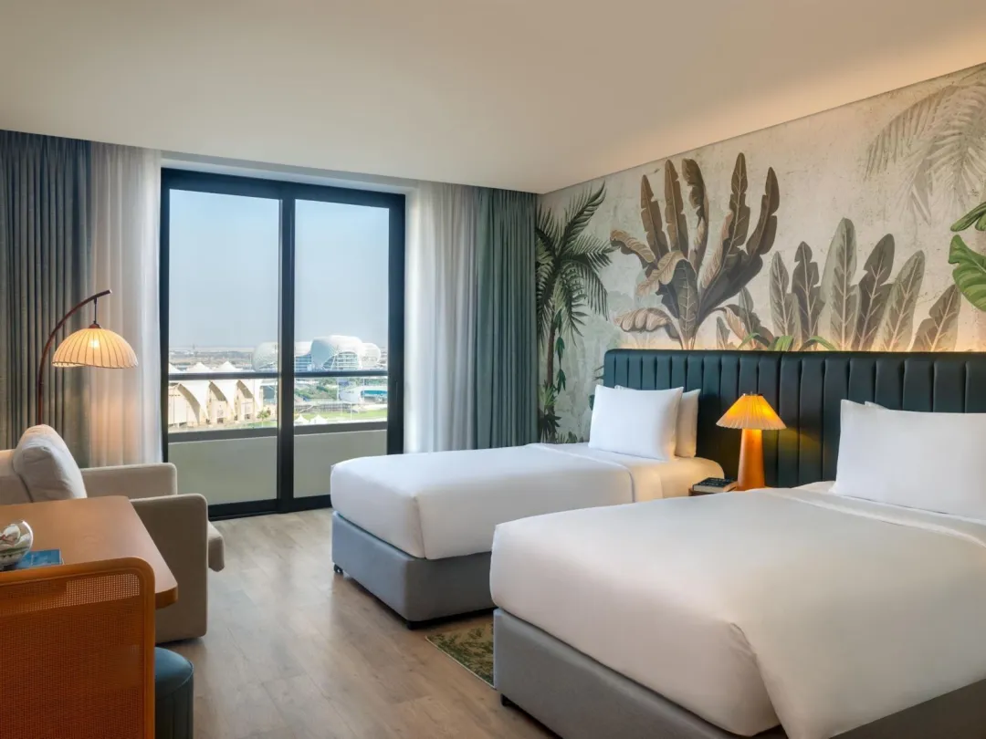 Odysseys Travel - Yas Plaza Mangroves by IHG - Two Twin Deluxe Plaza View Theme Park Access - Bedroom