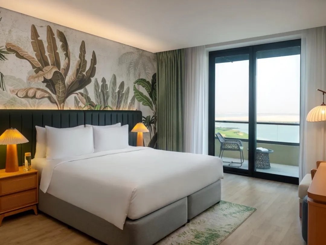 Odysseys Travel - Yas Plaza Mangroves by IHG - One King Deluxe Plaza View Balcony Theme Park Access - Bedroom
