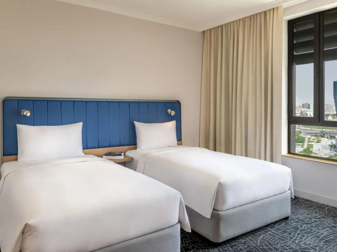 Odysseys Travel - Yas Plaza Bay - Deluxe Family Suite Plaza View - Bedroom