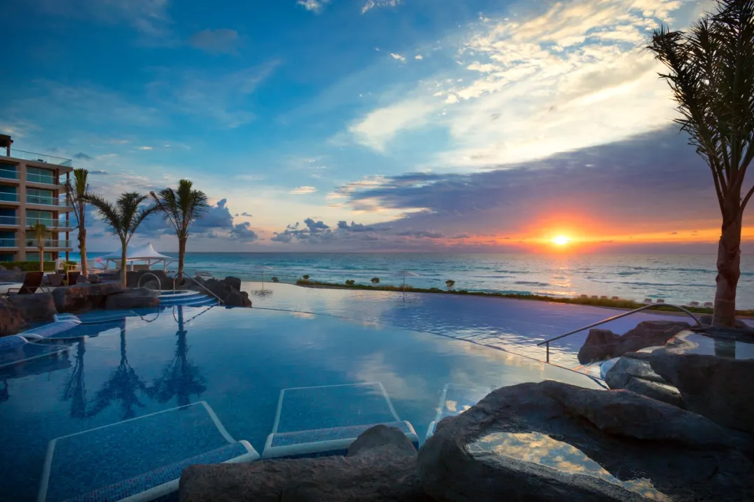 Odysseys Travel - Hard Rock Hotel Cancun - Infinity Pool at Sunset