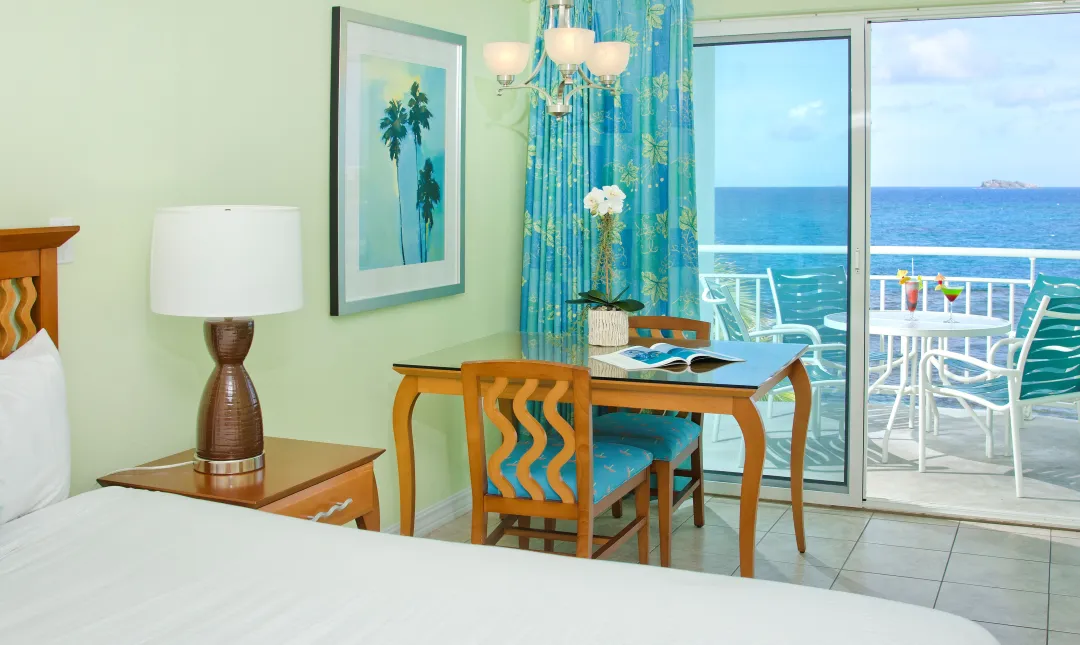 Odysseys Travel - Oyster Bay Beach Resort - Studio Oceanfront - Bedroom and Balcony