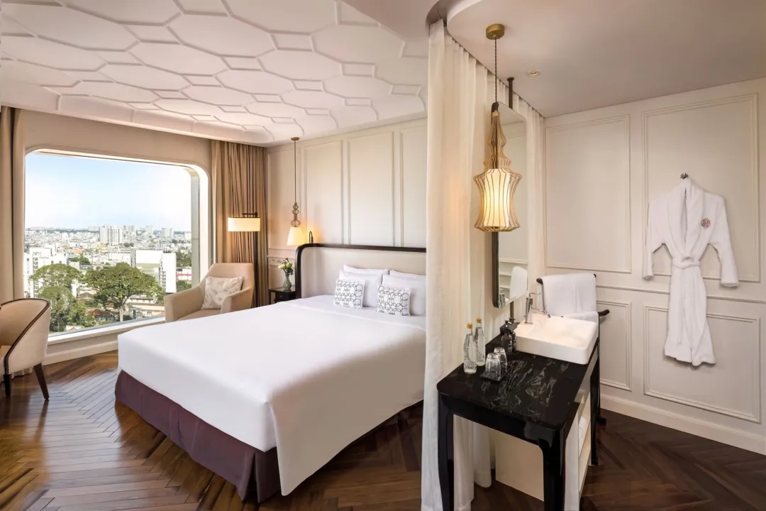 Odysseys Travel - Hotel des Arts Saigon - Rooms - Deluxe Corner Room - Bedroom and Vanity Area