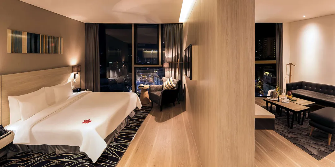 Odysseys Travel - Liberty Central Saigon City Point - Rooms - Liberty Central Suite - Bedroom and Lounge Area