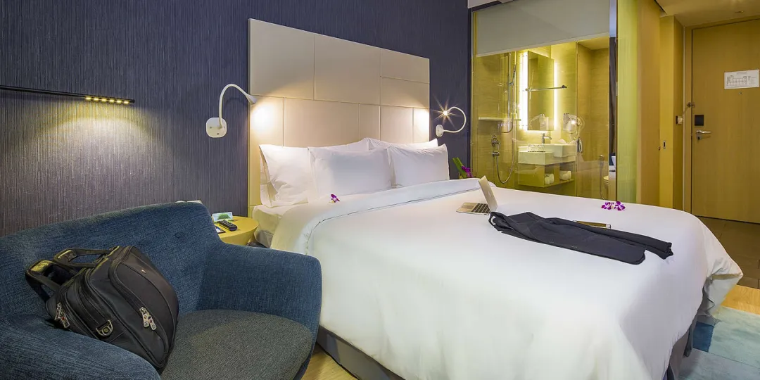 Odysseys Travel - Liberty Central Saigon Riverside - Rooms - Premier River View - Bedroom Seating Area