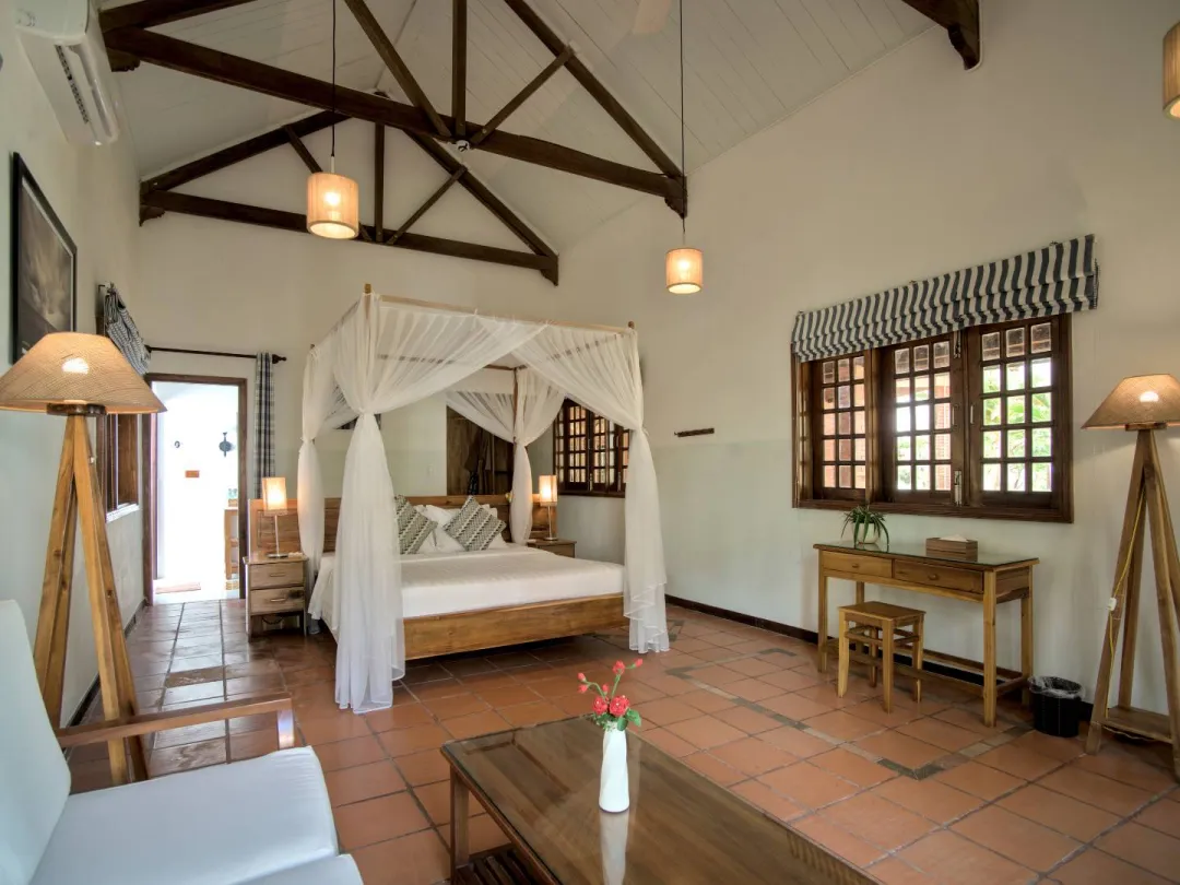 Odysseys Travel - Cassia Cottage Phu Quoc - Rooms - Large Seaview Guest Room - Bedroom Seating Area