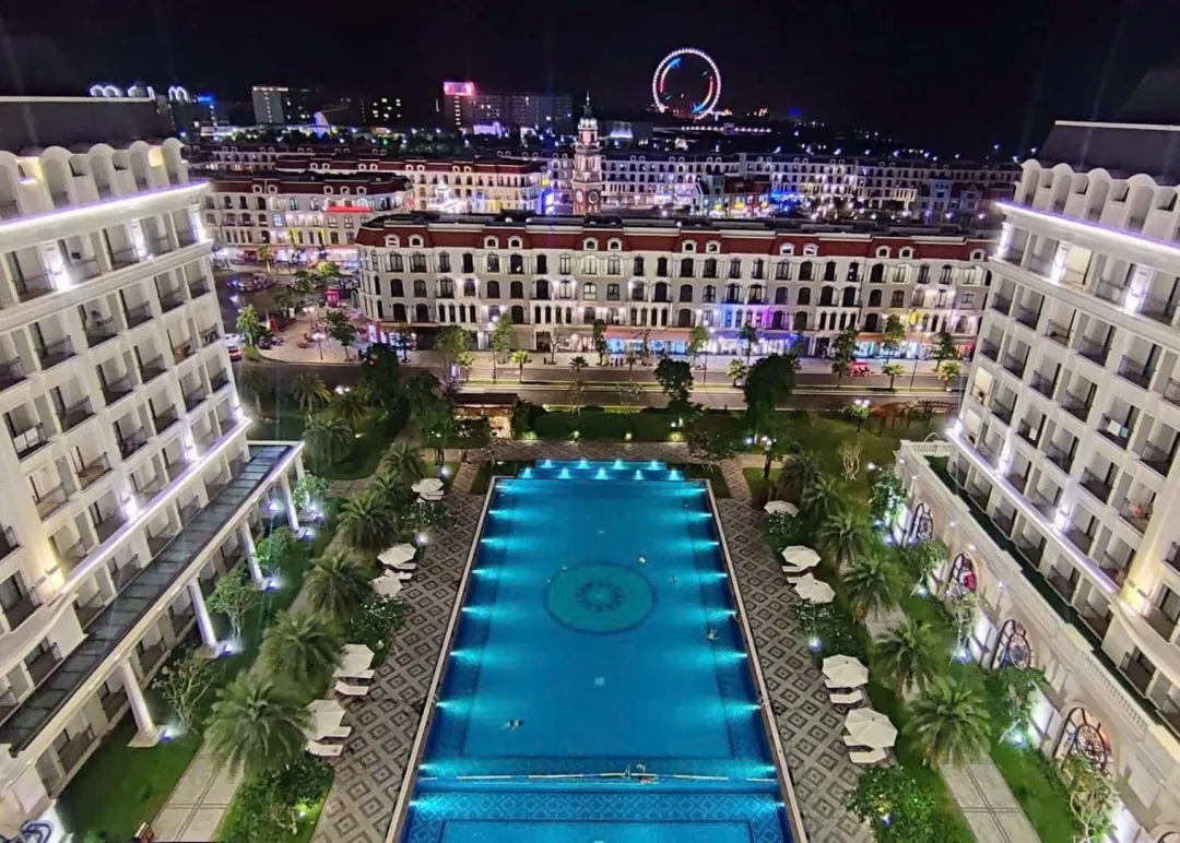 Odysseys Travel - VinHolidays Fiesta Phu Quoc - Pool Aerial at Night